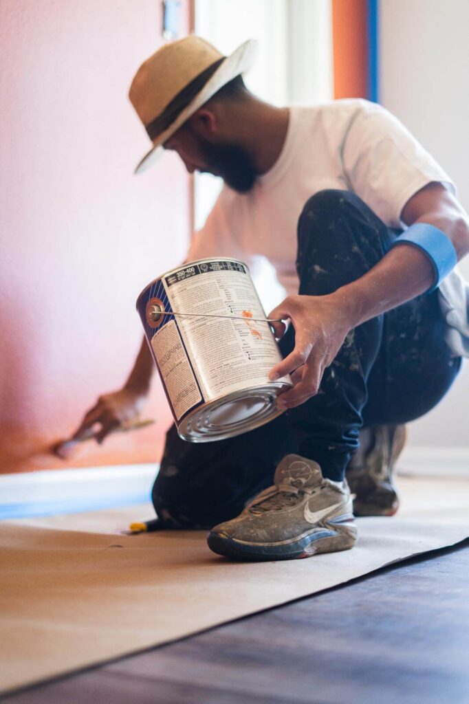 Man painting trim